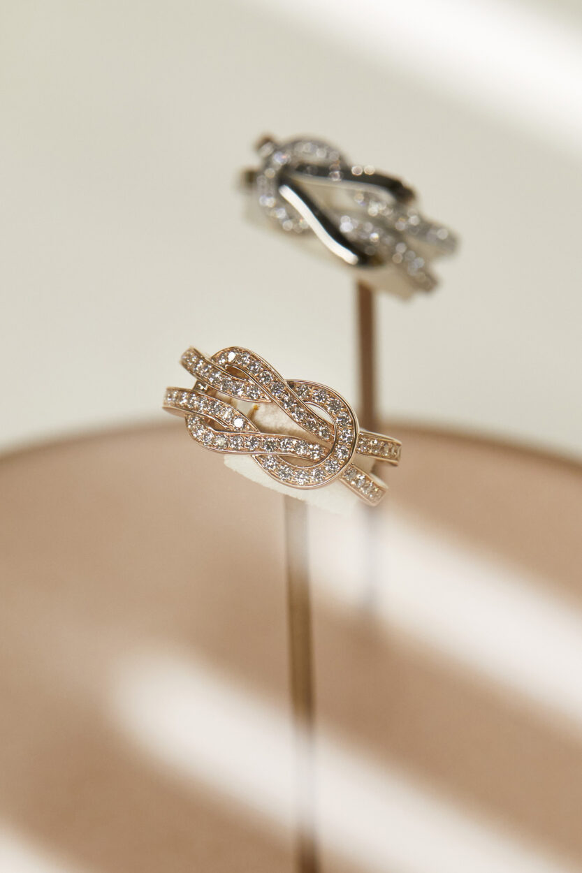 fred jewelry on a stand