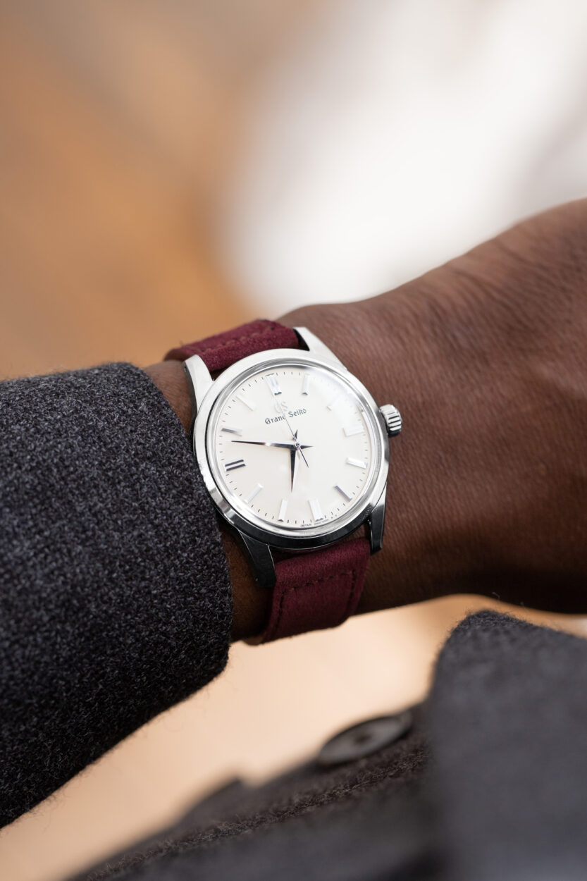 Grand Seiko on the wrist with oxblood red molequin strap