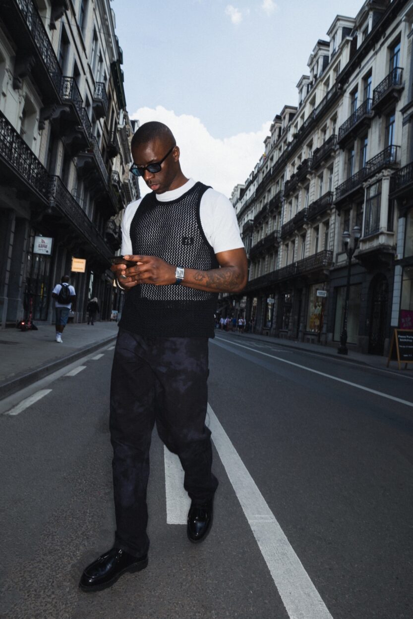 Cédric from Arte walking in the Dansaert area with a Cartier Santos Dumont watch on the wrist