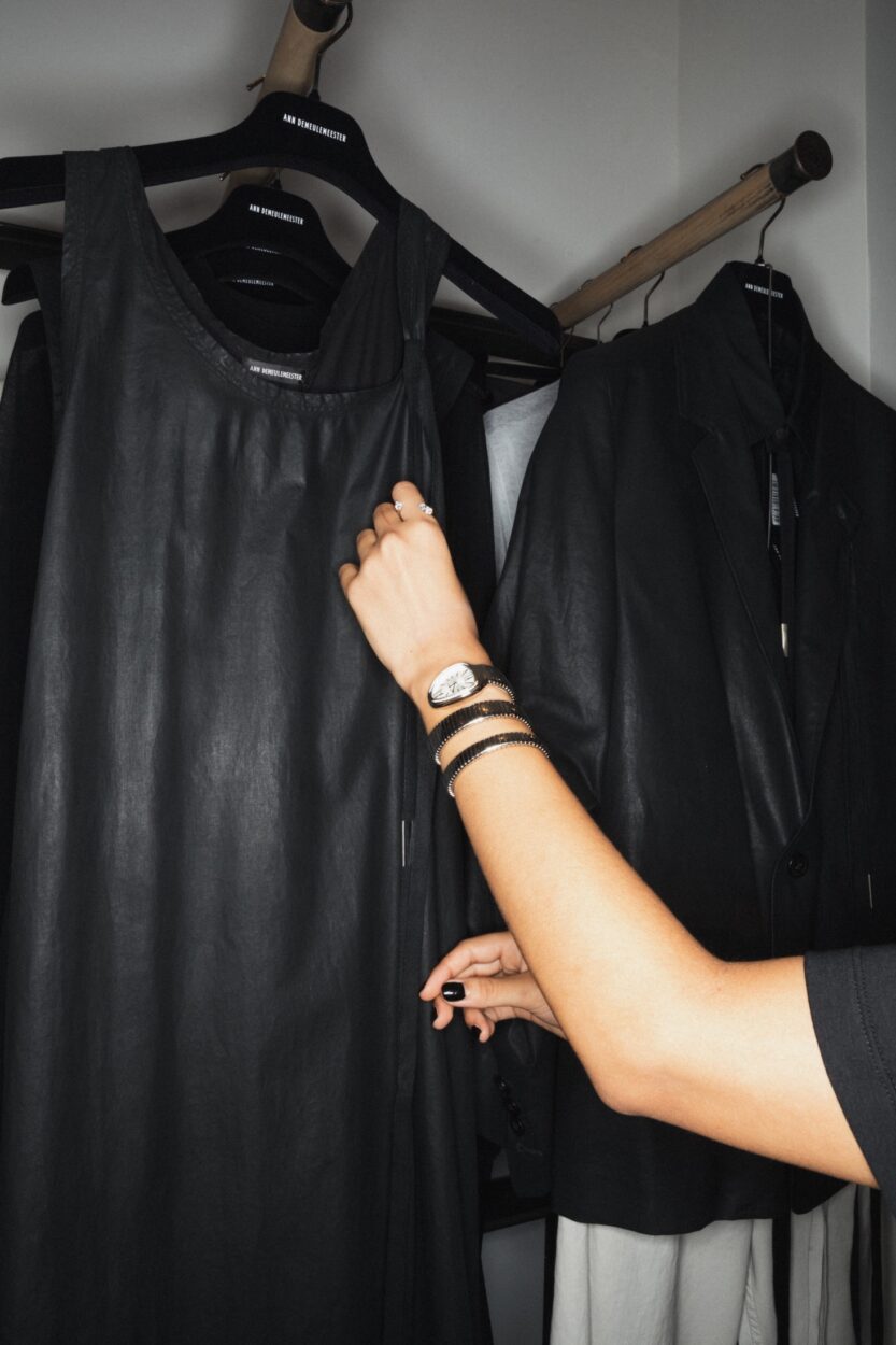 a woman is wearing a Repossi Serti sur Vide ring in white gold and the the Bulgari Serpenti Tubogas watch
