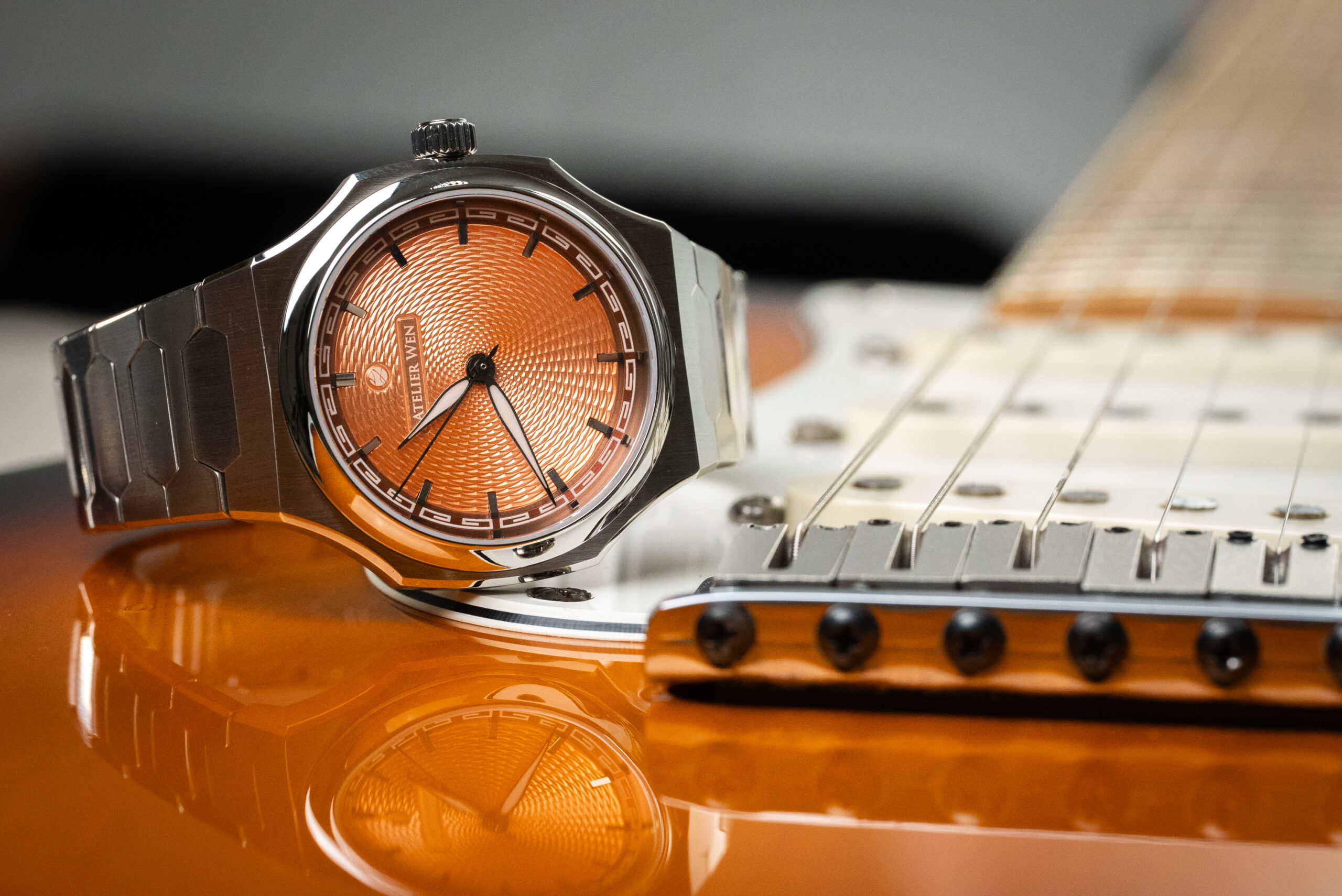 Atelier Wen orange on a guitar